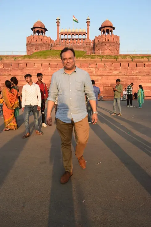 Sabbir Karim walking in front of the Red Fort in Delhi