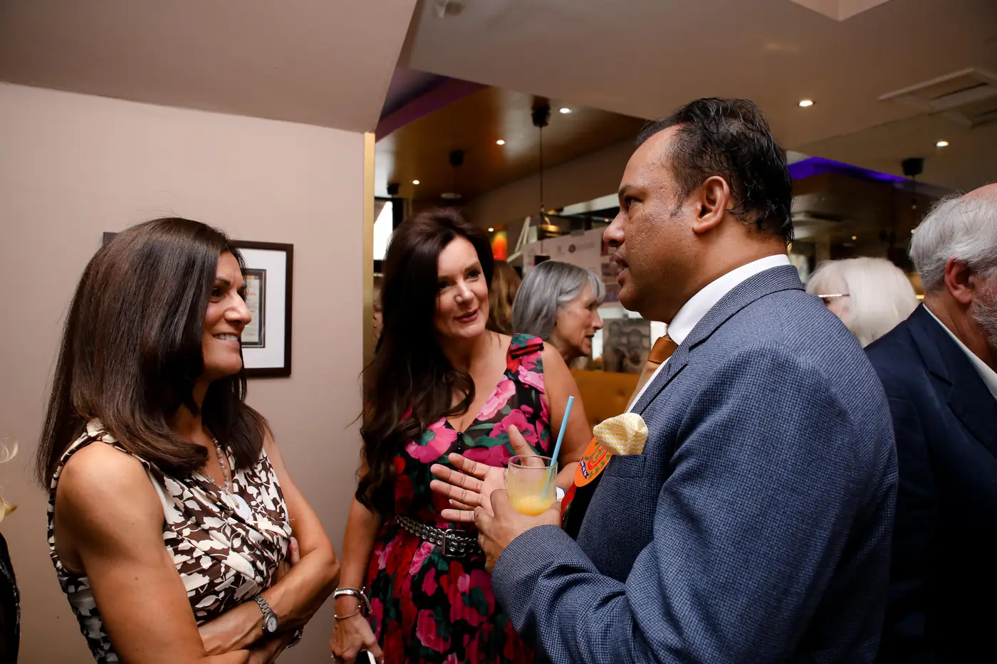 Sabbir Karim in conversation with guests at an event